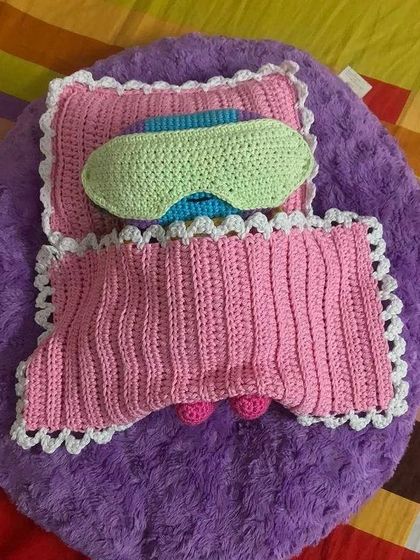 Zeno is all tucked in under his pink blanket with his sleep mask on. I love when clients have creative ideas for accessories.
