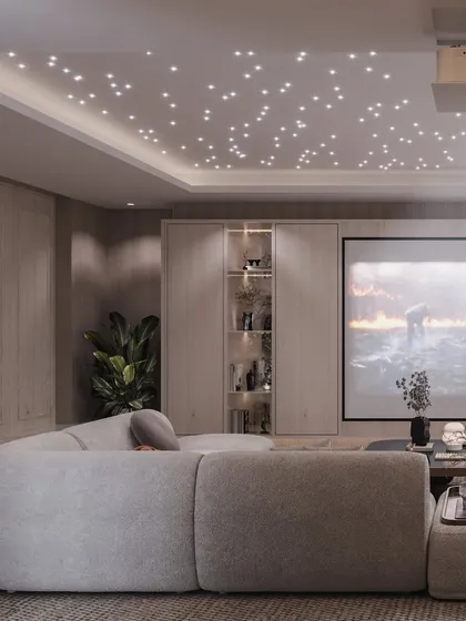 Another angle of the cinema room, showing the projector and the overall layout.