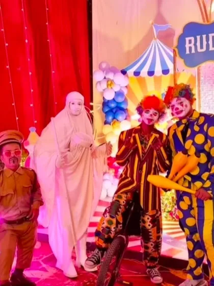 Our party entertainment includes a team of professional costumed characters. We can provide clowns, magicians, and other entertainers, like this group at a carnival party, to interact with children and keep the energy high throughout the event.
