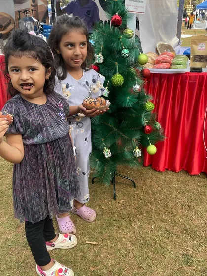 The cutest little clients enjoying their treats at a Christmas pop-up.