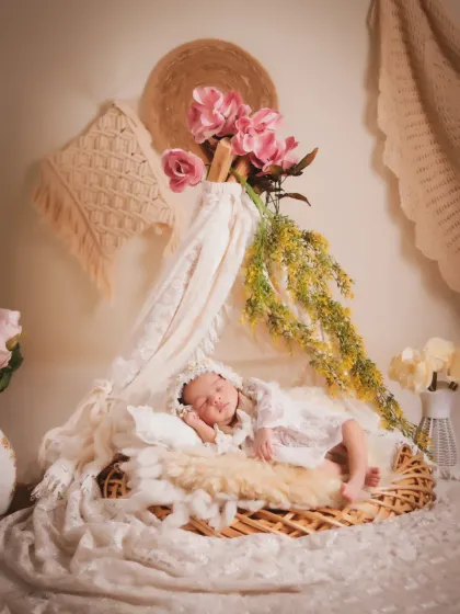 An example of our boho-themed sessions, featuring soft lace, natural textures, and delicate floral elements. We create these artistic, light-filled portraits for a timeless and elegant look.