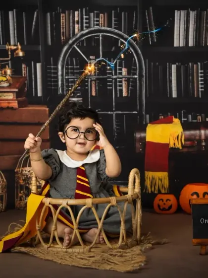 It's not just for Harry. This little girl makes a perfect Hermione Granger, captured in our Hogwarts library set for her first birthday.