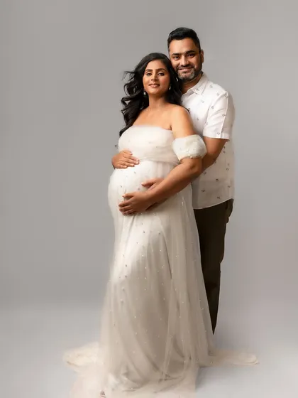A beautiful, formal portrait in a stunning white gown. They look so elegant and happy together.