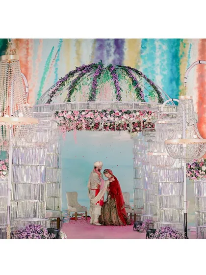 The full view of the magnificent crystal mandap we used for a beachside varmala in Goa. The grandeur of the setup contrasts beautifully with the natural ocean setting.