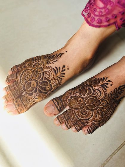 The final stain of the same feet design, showing the beautiful, rich color.