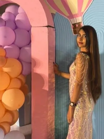 Another look at the custom birthday gown, showing how the pastel sequins shimmer against the festive backdrop.