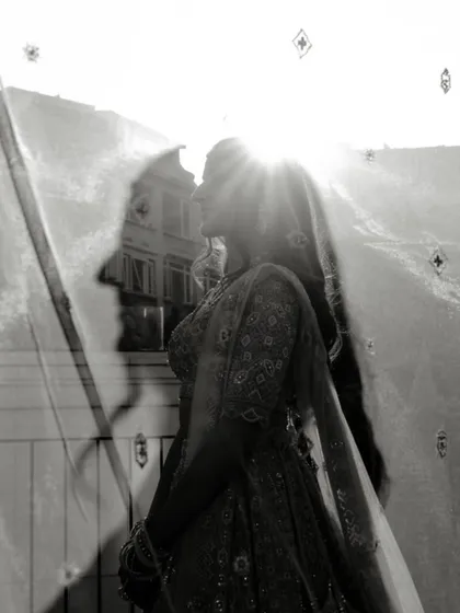 An artistic black and white double exposure. The silhouette of the groom is overlaid on a sunlit portrait of the bride, creating a poetic and symbolic image of their union during their pre-wedding shoot in Turkey.