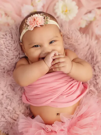 A happy, gummy smile from this four-month-old princess. These milestone sessions are full of personality.