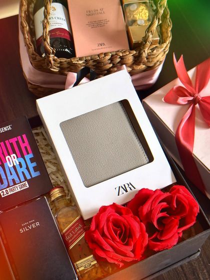 A fun and stylish Valentine's hamper for him. This gift includes a Zara wallet, a Red Label miniature, a "Truth or Dare" drinking game, and a Zara mini perfume.