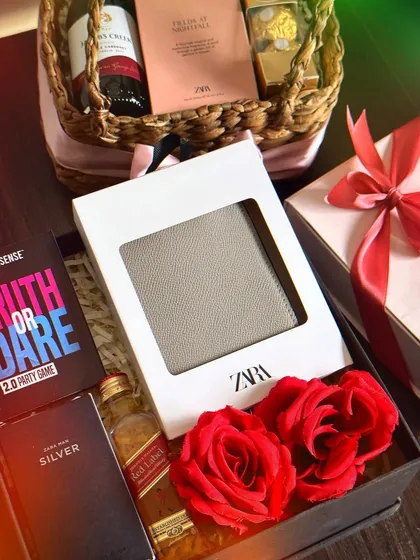 A fun Valentine's hamper for him, including a Zara wallet, a Red Label miniature, a "Truth or Dare" party game, and a mini perfume.