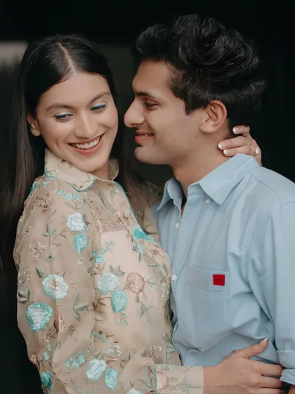 A sweet and playful candid moment. The genuine smiles and easy embrace in this shot perfectly capture the lighthearted and affectionate nature of this couple's relationship.