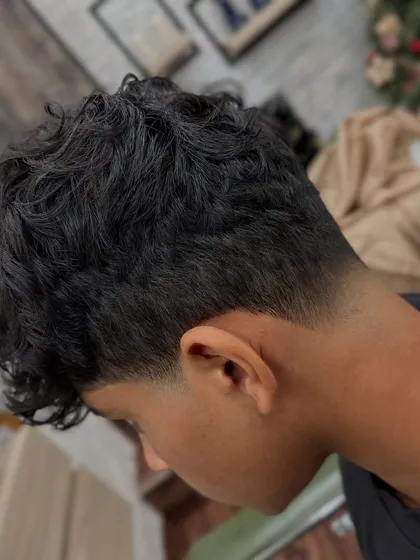 This is the kind of clean, sharp taper fade you'll learn to master in our barbering courses. We focus on precision, technique, and the small details that elevate a good haircut to a great one.