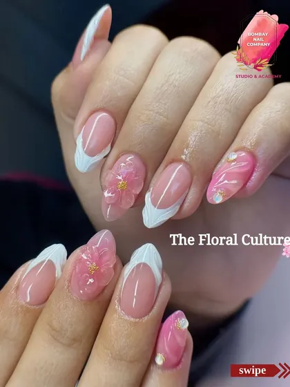 Part of our festive collection, this design features delicate 3D pink flowers on an elegant French tip base. The combination of sculpted art and classic design makes it perfect for any celebration.