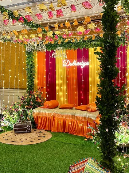 A full view of this fun and colorful Dholki setup. The bright drapes, fairy lights, and traditional dhol create a perfect atmosphere for singing and dancing the night away before the wedding.