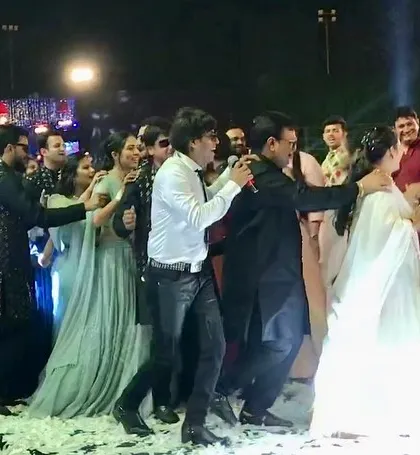 Dancing with the bride, groom, and their families in Surat. These interactive moments are what make a wedding performance truly special and memorable.