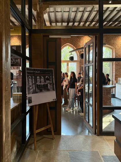 A view into our studio during the Open House event, with an exhibition panel on display.