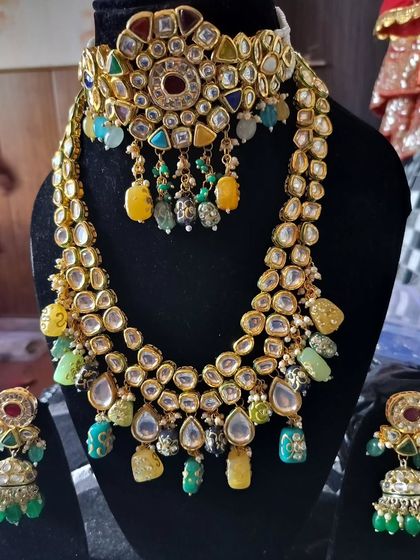 A Kundan choker and rani haar set with unique yellow and green uncut stones.