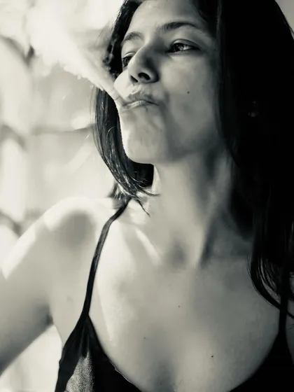 A black and white self-portrait exploring a femme fatale character. I don't smoke, but I use props like this to create a specific vibe and tell a visual story.