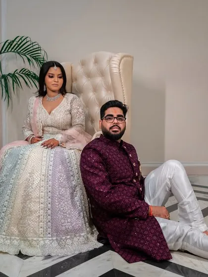 A relaxed, editorial-style portrait. This pose is modern and stylish, perfect for a contemporary couple.