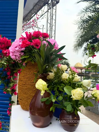 A close-up of the floral arrangements, showing the vibrant mix of pinks, yellows, and greens. I love creating arrangements that are bursting with color and life.