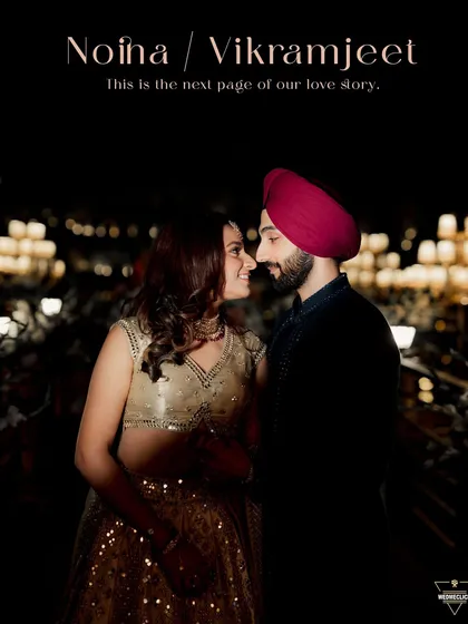 A romantic portrait of the couple at night, with a beautifully lit background creating a magical bokeh effect.