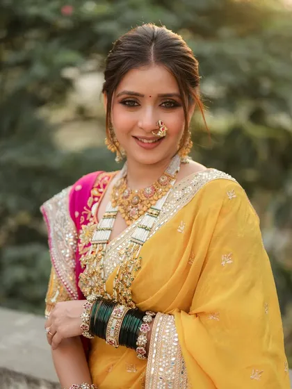A happy, smiling portrait of this beautiful bride. Her makeup is fresh and luminous, designed to last through all the emotional and joyful moments of her big day.