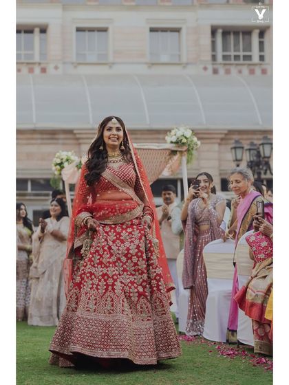 Her grand entrance. Walking down the aisle, she looks absolutely breathtaking with a look that is both elegant and timeless.