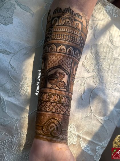 The full arm design, showing the palace armband combined with traditional pot motifs and lotus patterns.