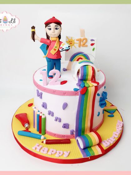 For the budding artist, this colorful cake is a masterpiece. It features a fondant artist figure, a cascading rainbow of "paint," and edible art supplies like colored pencils and paint tubes.