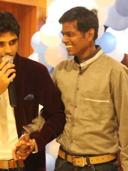 A candid moment of connection with a guest on stage. Building a good rapport with the audience is key to a successful and interactive event.