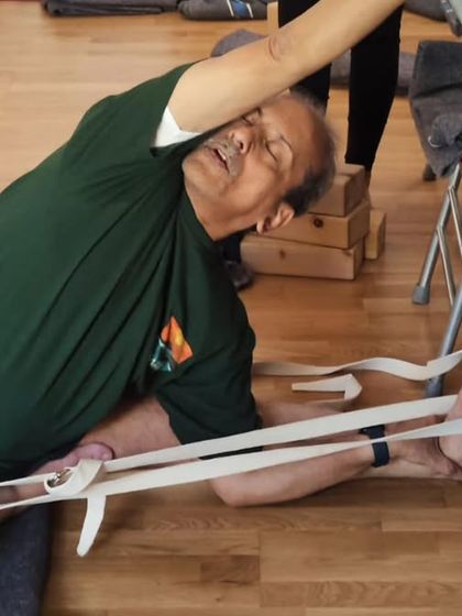 A seated forward bend with a chair.