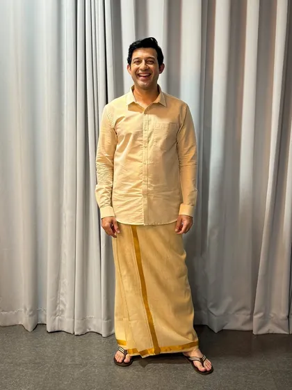Versatility is key in this industry. Here, I'm dressed in a traditional veshti for a specific character role. I'm comfortable and experienced in adapting my look for shoots that require ethnic or traditional wear.