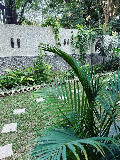 A view of a growing garden with a stepping stone path, showing how our designs mature over time.