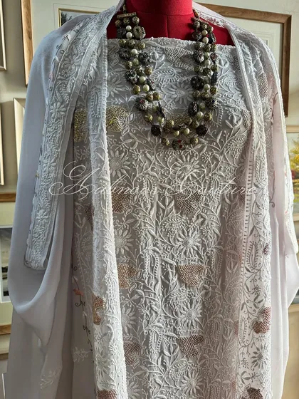 A full-length view of the suit, providing a clear perspective of the entire ensemble.