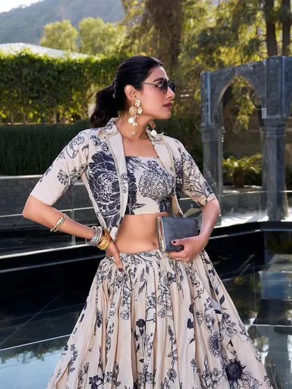 For a modern vibe with a traditional touch, I created this Tussar silk floral print lehenga. The jacket gives it a chic, Indo-Western feel, perfect for a brunch or a destination wedding event. It's elegance with a bit of an edge.
