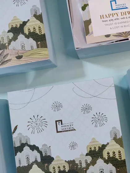 We specialize in creating memorable corporate gifts. Here are custom-branded Diwali boxes we designed for a client, showcasing how we can incorporate your company's identity into a beautiful, festive package.