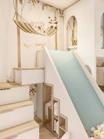 For this child's bedroom, the goal was to create a world of play and imagination. The design includes a custom bunk bed with an integrated slide that leads directly into a ball pit, along with clever storage solutions built into the stairs.