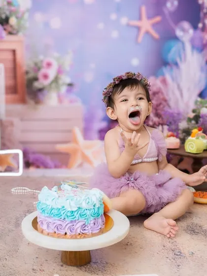 Pure, cheeky joy! This is the goal of every cake smash session: to capture your baby's personality as they celebrate their first big milestone.