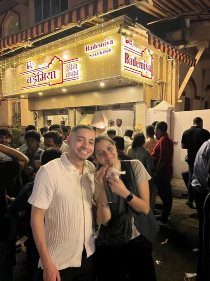 A happy couple enjoying a late-night snack at our bustling Colaba location. It's a rule of thumb: when in Mumbai, a visit to Bademiya is a must.
