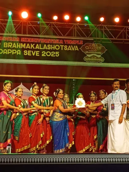 Receiving a token of appreciation on behalf of the troupe after our performance at the Madhur temple festival. It is always a joy to be recognized for our devotional offering.