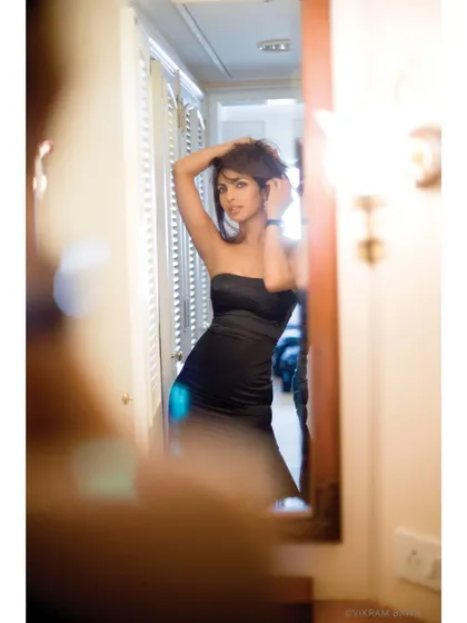 Caught in a candid shimmer. A voyeuristic shot of Priyanka Chopra getting ready, taken for a Hello! Magazine editorial, playing with reflections and soft focus.