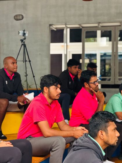 My coaches listen intently during a presentation on anti-doping rules. True sportsmanship begins with integrity, and we ensure our entire team is educated on the subject.