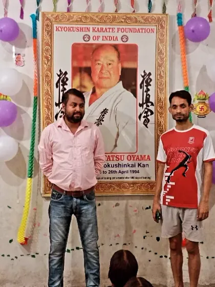 Posing with a senior student during our dojo's anniversary. These celebrations are a time to reflect on our journey.