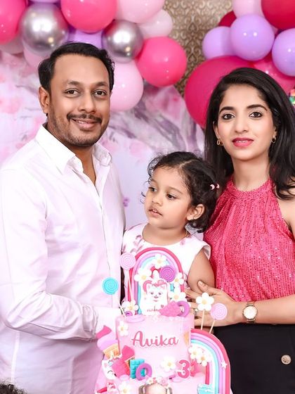 A playful 'Mickey Mouse' themed birthday party, with bright colors, character cutouts, and a fun balloon arch, creating a joyful atmosphere for little ones.