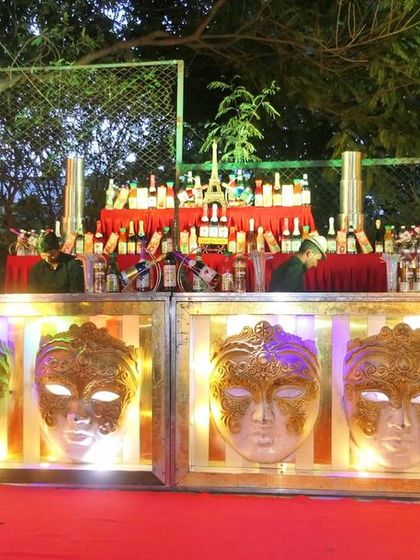 The mocktail bar glowing in the evening. A well-stocked and beautifully designed bar is essential for keeping guests refreshed throughout the event.