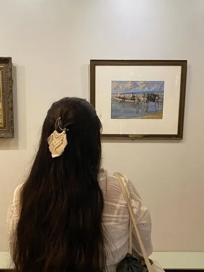 A candid shot of our moon clip being worn. It shows how our accessories can be styled for everyday outings, adding a unique, handmade element to your hair.