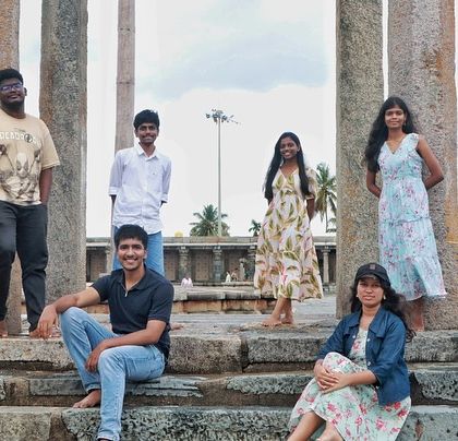 Posing among the historic pillars of a temple in the Agumbe region. My itineraries balance nature treks with cultural exploration.