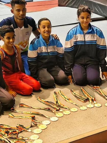 More moments of triumph from various competitions, showcasing our gymnasts with their medals, trophies, and proud coaches.