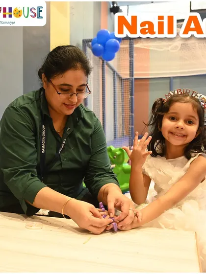 A guest proudly shows off her freshly painted nails. Our nail art station is a highlight of our pamper parties, making the kids feel extra special.