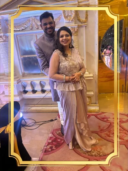 Another look at this stylish couple. The groom's Jodhpuri jacket and the bride's peplum-style top create a unique silhouette that’s perfect for a sangeet or engagement party.